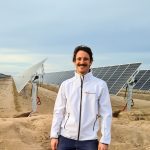 See exhibit A – A Homo Sapiens Power System Engineer in front of solar panels, who has attempted to spice up its appearance in order to elevate its self-confidence and social status.