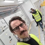 Representation the Buyer (MCA) during FAT of E-house (Electronics house) at Jaco, Swedish producer of special-purpose E-houses. Picture shows part of the inside of the E-house (here Medium Voltage MV-switchgear). The E-house also contained control and protection systems, 110 V DC system and more.